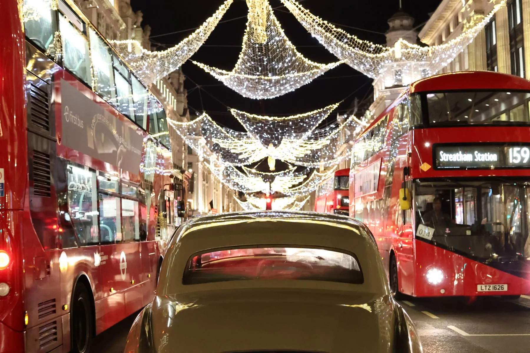 Vintage Rolls-Royce Silver Cloud I under Christmas lights in Central London