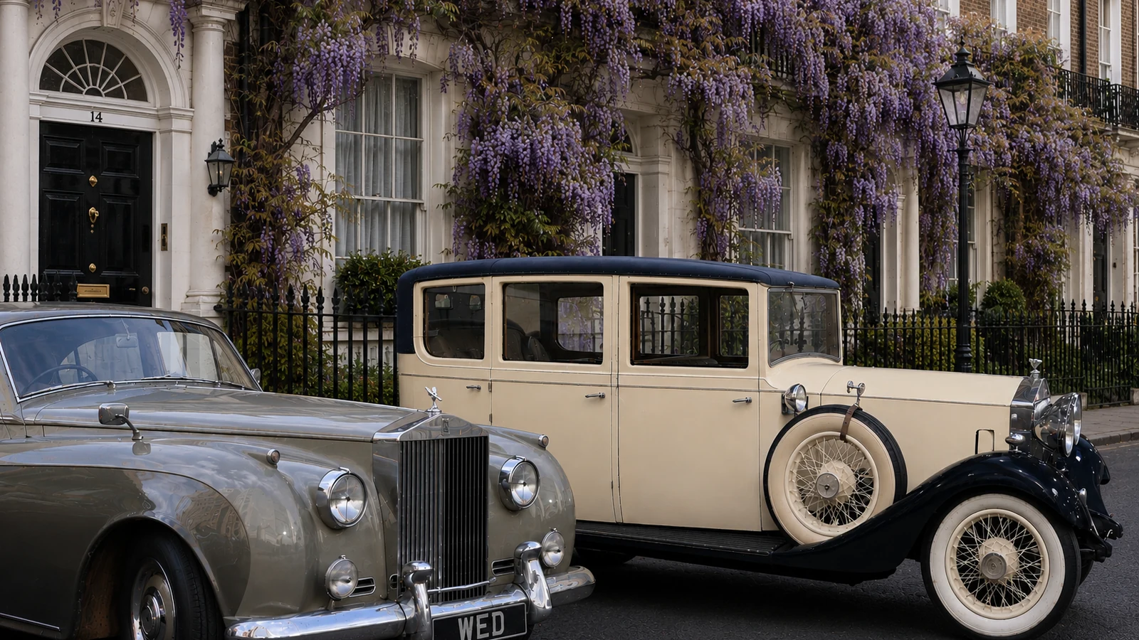 A 1930s Rolls-Royce 20/25 Landaulette and a 1950s Rolls-Royce Silver Cloud I parked together on a wisteria-draped London townhouse street